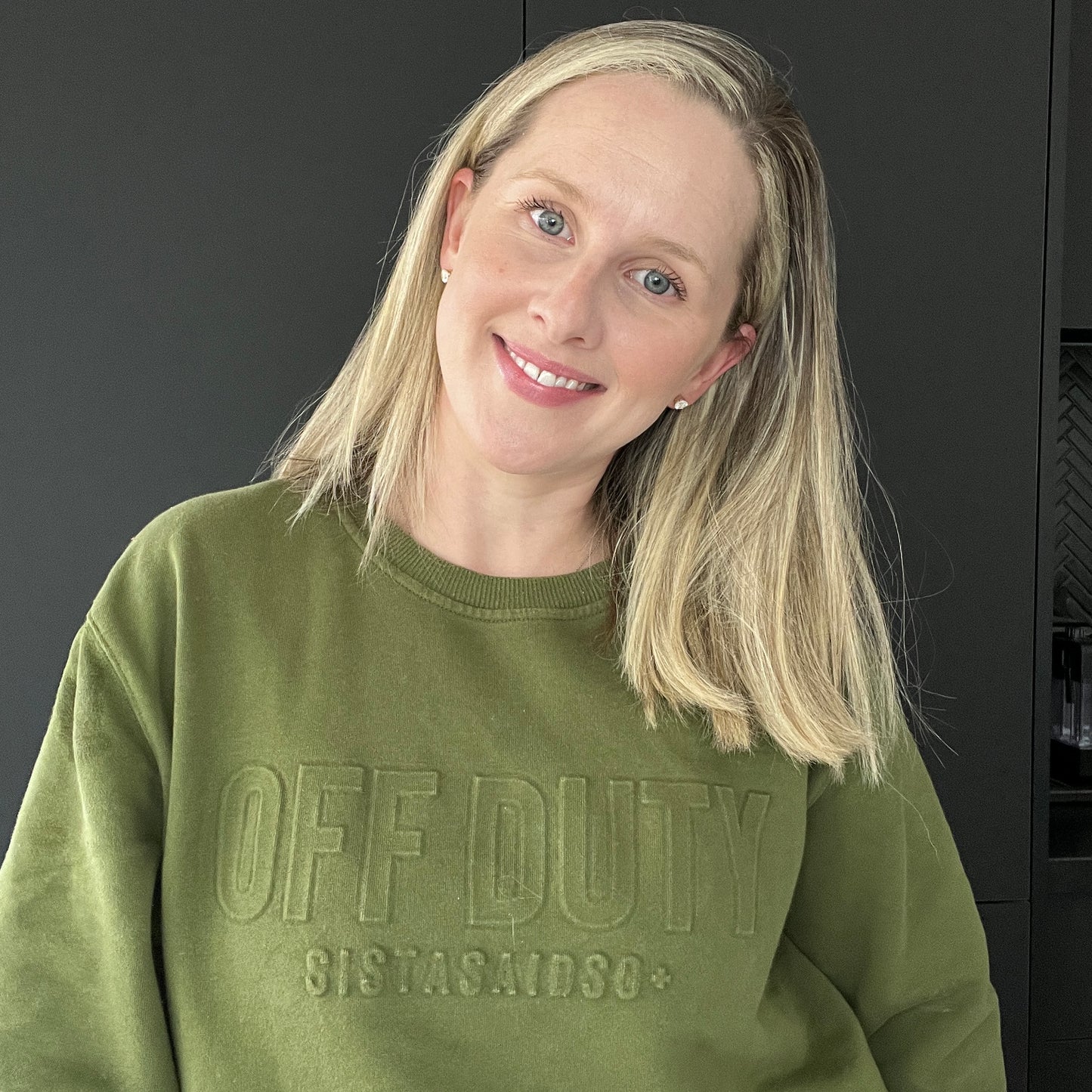 OFF DUTY™️ Unisex Forest Sweater modelled by a nurse