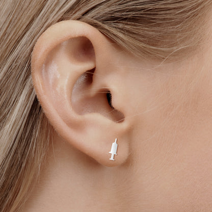 'IV Therapy Earrings' in silver on nurse model ear